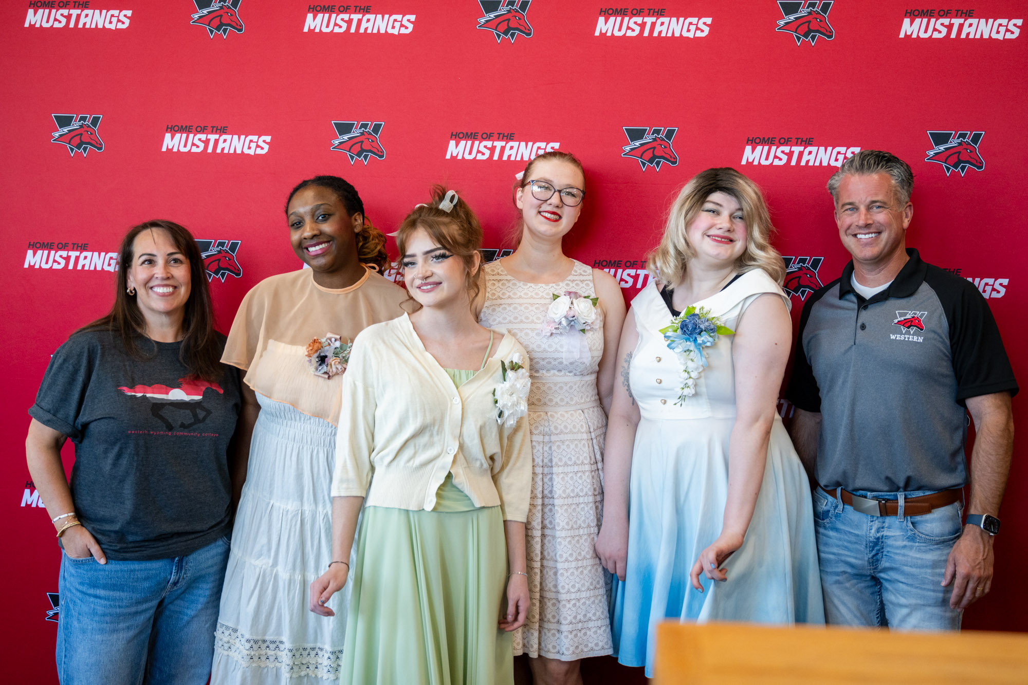 The Marvelous Wonderette Theatre performers posing with Dr. Kirk Young and his wife