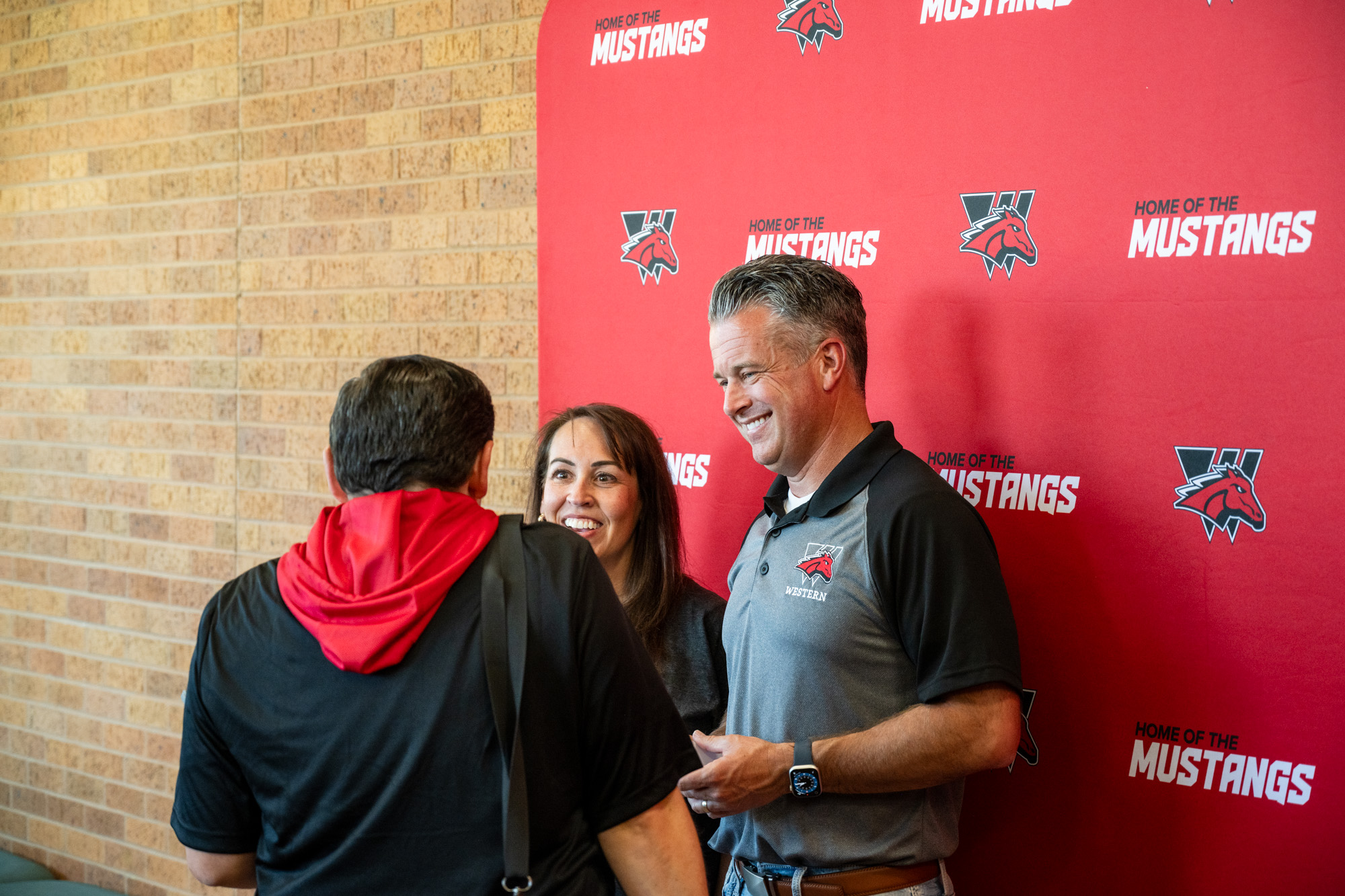 Mr. and Mrs. Young meeting new faculty member.