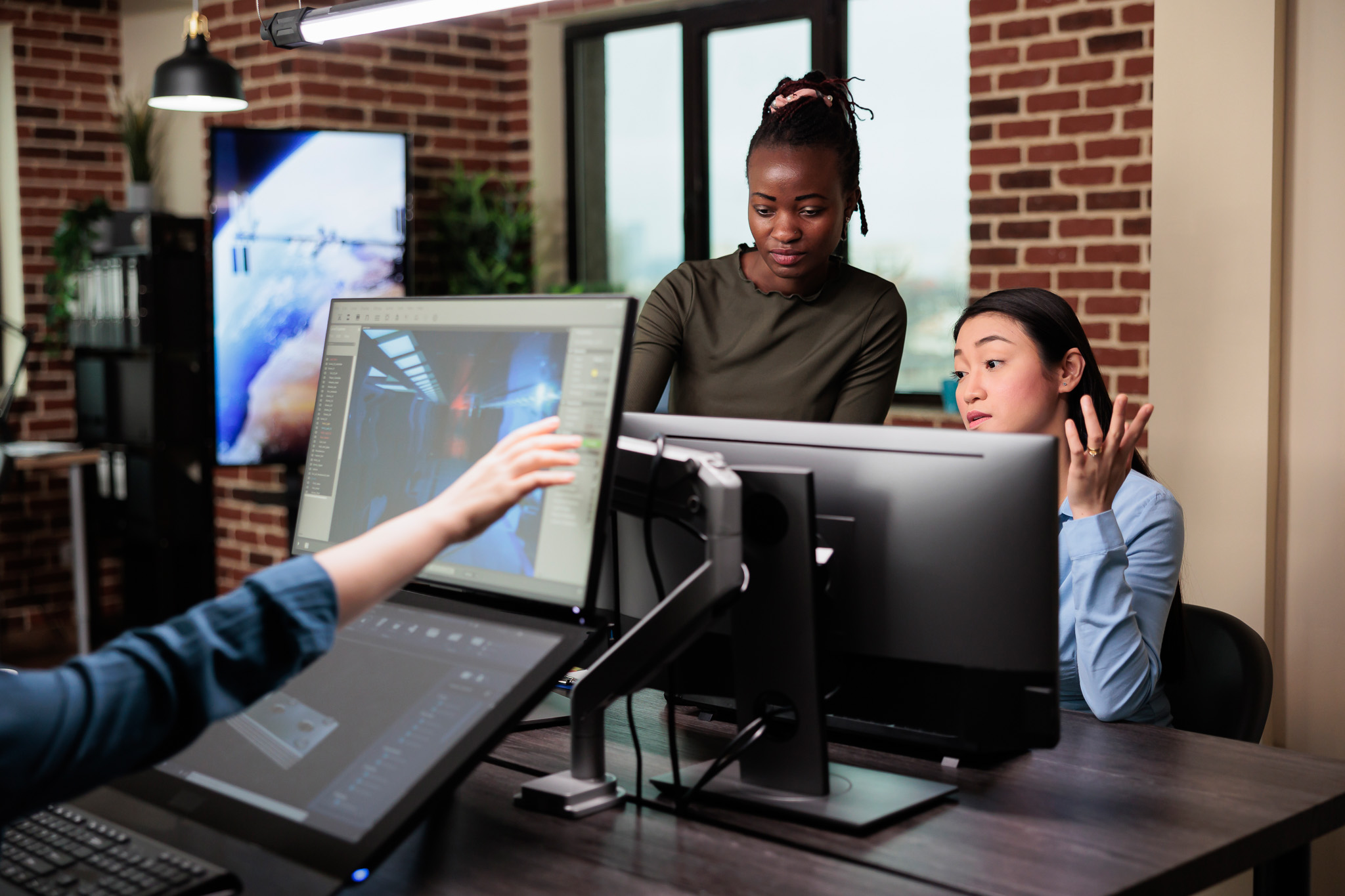 Image of students sitting in a room working on computers 