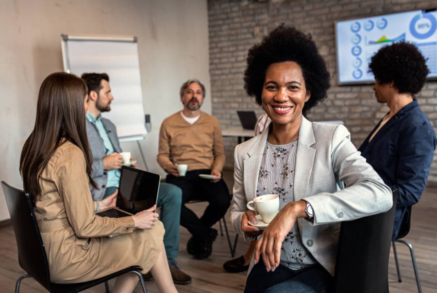 Portrait of businesswoman having a meeting while sitting in circle