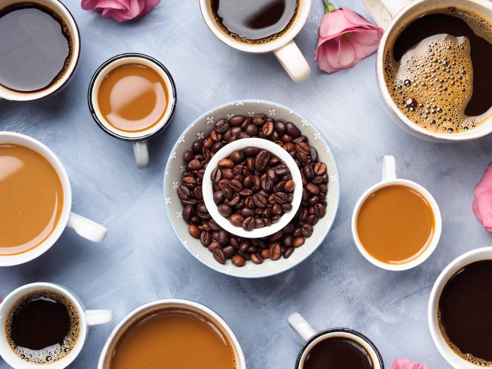 Coffee beans and coffee in mugs