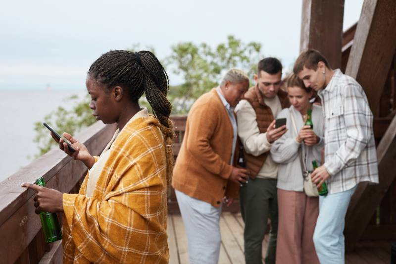 Diverse Group of Young People in Lake House