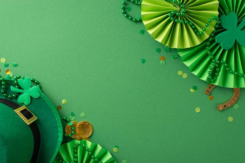 Saint Patrick's Day celebration in one frame: top view leprechaun's hat, fortunate horseshoe